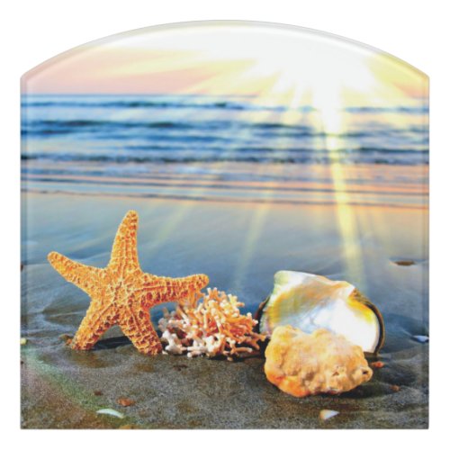 Sea shells and starfish on beach door sign