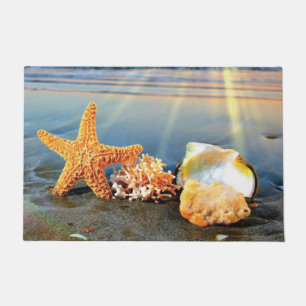 Sea shells and starfish on beach doormat