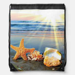 Sea shells and starfish on beach drawstring bag