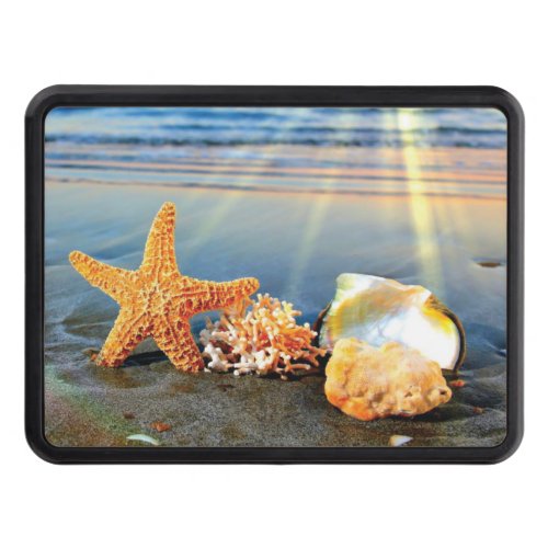 Sea shells and starfish on beach hitch cover