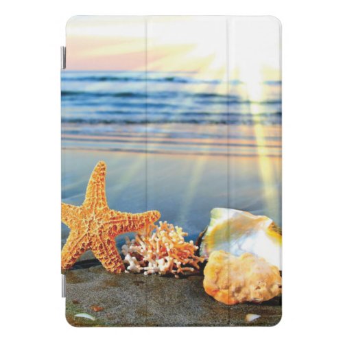 Sea shells and starfish on beach iPad pro cover