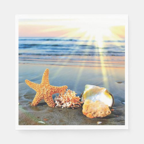 Sea shells and starfish on beach napkins