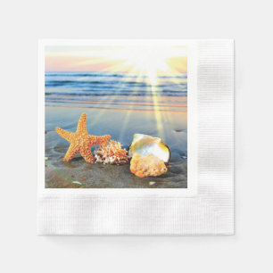 Sea shells and starfish on beach napkins