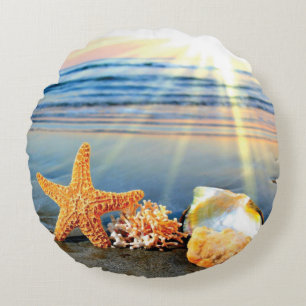 Sea shells and starfish on beach round pillow