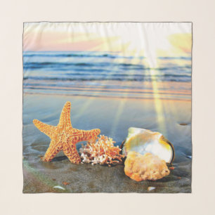 Sea shells and starfish on beach scarf