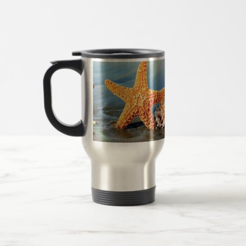 Sea shells and starfish on beach travel mug