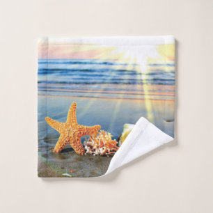 Sea shells and starfish on beach wash cloth