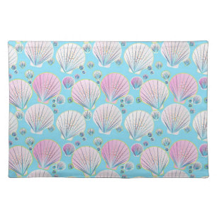 Sea shells on a turquoise blue background cloth placemat