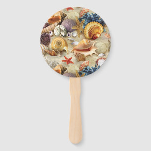 Sea shells on beach hand fan