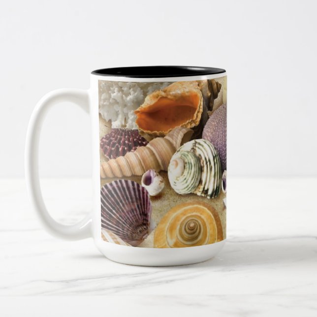 Sea shells on beach Two-Tone coffee mug (Left)
