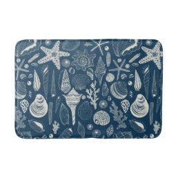 Sea shells on  dark blue bath mat