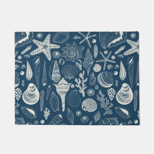 Sea shells on  dark blue doormat