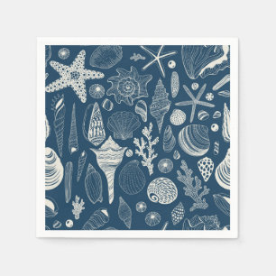 Sea shells on dark blue napkins