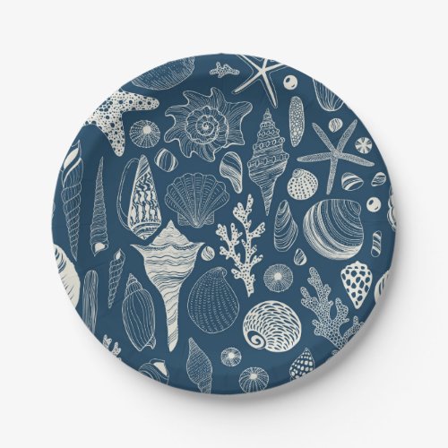 Sea shells on  dark blue paper plates