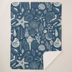 Sea shells on dark blue sherpa blanket