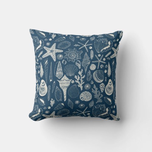 Sea shells on  dark blue throw pillow