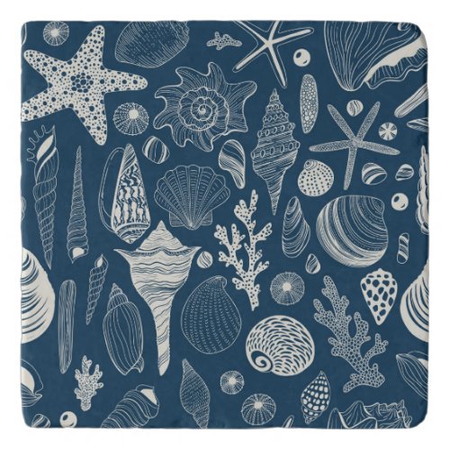 Sea shells on  dark blue trivet
