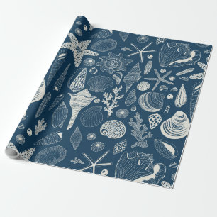 Sea shells on dark blue wrapping paper