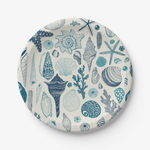 Sea shells on off white paper plates