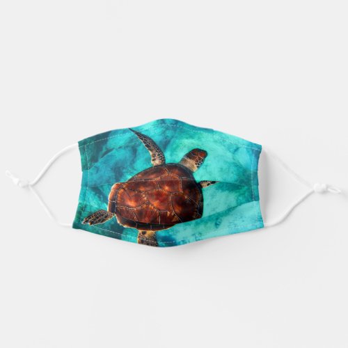Sea turtle in the blue ocean_ bestselling adult cloth face mask