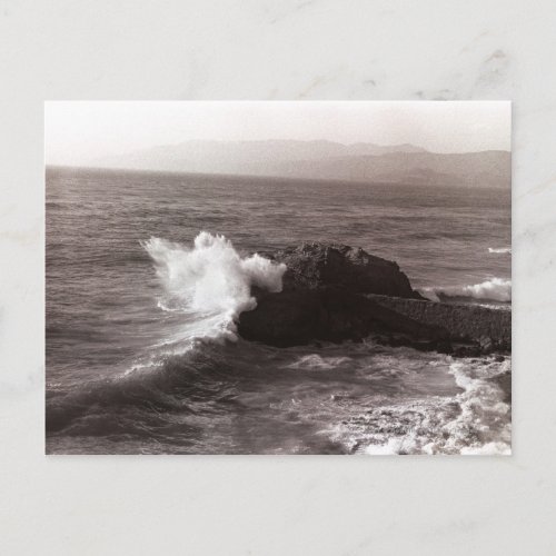 Sea waves crashing against rock postcard