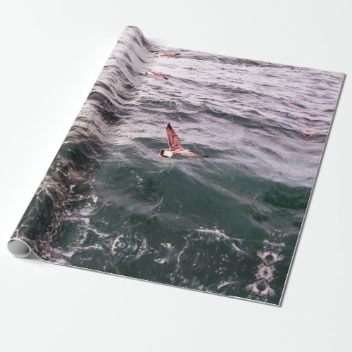 SEAGULL FLYING OVER THE SEA WAVES WRAPPING PAPER