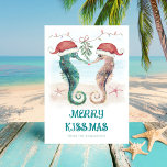 Seahorse Mistletoe Merry Kissmas Coastal Christmas Holiday Card<br><div class="desc">Share some love with this coastal Christmas card featuring watercolor seahorses in Santa hats kissing under mistletoe on the beach with a "Merry Kissmas" greeting. Visit my "Seahorse Coastal Christmas Kiss" collection for coordinating invitations,  party supplies,  decor and more. Art by KL Stock.</div>