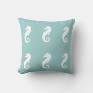 SEAHORSE OFF WHITE on blue pillow