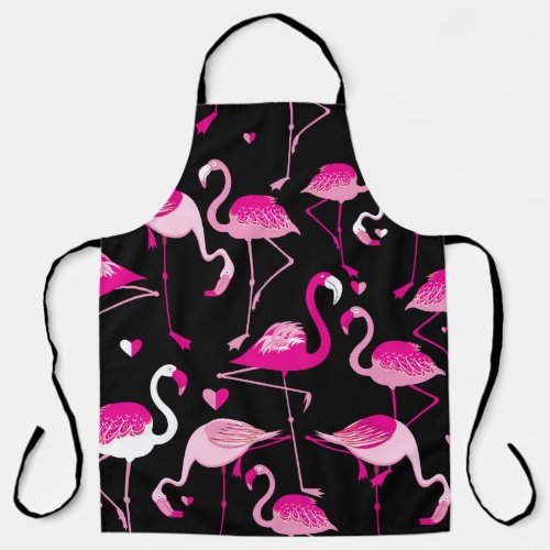 Seamless pattern from pink flamingos on a dark bac apron