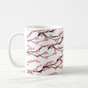 Seamless pattern with blooming cherry on a white b coffee mug
