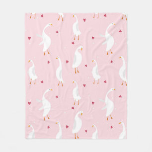 Seamless pattern with cute duck with heart on pink fleece blanket