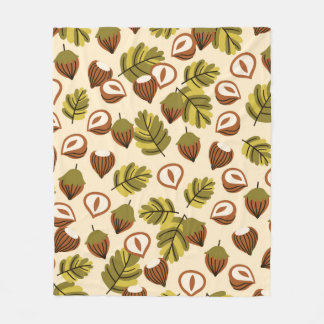 Seamless pattern with hazelnut leaves and acorns. fleece blanket