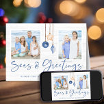 Seas and Greetings Coastal Wood Holiday Photo<br><div class="desc">Seas and Greetings Seashell Ornament on Coastal Wood Holiday Photo Folded Christmas Cards featuring ocean navy blue and sandy tan shell ornaments hanging from sailing jute rope on coastal shiplap wood with elegant typography. Add two of your photos and a personal message to the inside for a fun nautical holiday...</div>