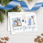 Seas and Greetings Coastal Wood Holiday Photo Postcard<br><div class="desc">Seas and Greetings Seashell Ornament on Coastal Wood Holiday Photo Christmas Post Cards featuring ocean navy blue and sandy tan shell ornaments hanging from sailing jute rope on coastal shiplap wood with elegant typography. Add two of your photos and a personal message for a fun nautical holiday card that is...</div>