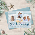 Seas and Greetings Coastal Wood Photo Holiday Card<br><div class="desc">Send warm Christmas wishes from the beach with this personalized coastal holiday card with 3 photos and “Seas & Greetings” in handwritten script typography. In the center is a group of watercolor seashells, with a beach wood background. *If you need assistance with this design or matching products, please contact me...</div>