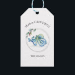 Seas and Greetings Favor Tags Watercolor Octopus<br><div class="desc">These Seas and Greetings beach wedding favor tags feature a watercolor octopus in shades of blue encircled by a string of Christmas lights. Use the template fields to add your custom thank you information in minimal text. A coastal choice for nautical themed holidays. Unique watercolor art and design by Victoria...</div>