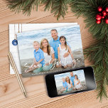 Seas and Greetings | Nautical Holiday Photo Card<br><div class="desc">Seas and Greetings Nautical Holiday Photo Christmas Cards featuring your photo and our elegant typography. The back showcases our ocean navy blue and sandy tan shell ornaments hanging from sailing jute rope on coastal shiplap wood. Add your and a personal message for a fun nautical holiday card. Please contact us...</div>