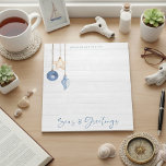 Seas and Greetings Seashell Ornament Wood Notepad<br><div class="desc">Seas and Greetings Seashell Ornament on Coastal Wood Holiday Christmas notepad featuring ocean navy blue and sandy tan shell ornaments hanging from sailing jute rope on coastal shiplap wood with elegant typography. Add your name for a fun nautical holiday gift. Please contact us at cedarandstring@gmail.com if you need assistance with...</div>