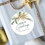 Seas N Greetings Tropical Christmas Starfish  Classic Round Sticker<br><div class="desc">These tropical Christmas stickers make great envelope seals to add a coastal beach touch to your holiday mail,  with two starfish decorated with holly leaves,  berries and pine sprigs,  and the beachy saying “seas n’ greetings.”</div>