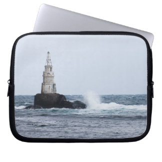 Seascape with lighthouse laptop sleeve