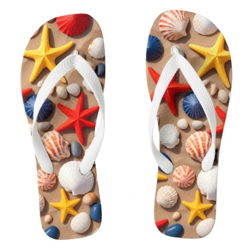  Seashells starfish and pebbles on a sandy beach Flip Flops
