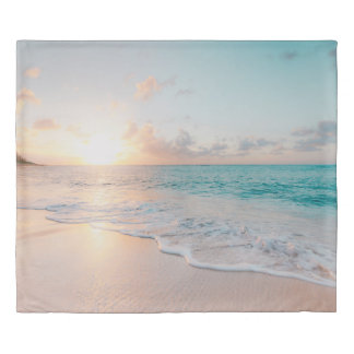 Seashore during golden hour duvet cover
