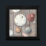 Seashore Treasures Jewelry Box<br><div class="desc">Megan Meagher is known for her simple art pieces. This image captures the simplicity of the seashore's treasures, including sand dollars and seashells in a pastel colored tone. Meagher encompasses a wooden background in her image to contrast these treasures. Get this fine art print today on wood color on your...</div>