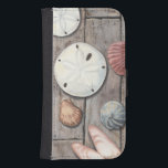 Seashore Treasures Galaxy S4 Wallet Case<br><div class="desc">Megan Meagher is known for her simple art pieces. This image captures the simplicity of the seashore's treasures, including sand dollars and seashells in a pastel colored tone. Meagher encompasses a wooden background in her image to contrast these treasures. Get this fine art print today on wood color on your...</div>