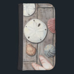 Seashore Treasures Galaxy S4 Wallet Case<br><div class="desc">Megan Meagher is known for her simple art pieces. This image captures the simplicity of the seashore's treasures, including sand dollars and seashells in a pastel colored tone. Meagher encompasses a wooden background in her image to contrast these treasures. Get this fine art print today on wood color on your...</div>