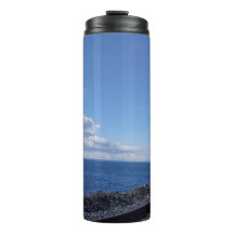 seaside and train track under blue sky