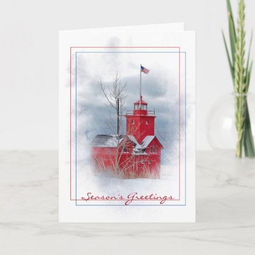 seasons greeting red lighthouse in snow holiday card