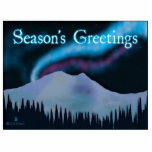 Season's Greetings - Blue Aurora Cutout<br><div class="desc">Purple and blue northern lights glow over snow-covered mountains on a cold night in Alaska. Text reading,  "Season's Greetings" appears in glowing blue and white.</div>