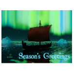 Season's Greetings - Viking Ship Statuette<br><div class="desc">A slightly stylized image of a Viking longship sailing at night under the Northern Lights,  there a couple of icebergs; most of the crew is asleep. "Season's Greetings" appears in glowing blue and white.</div>