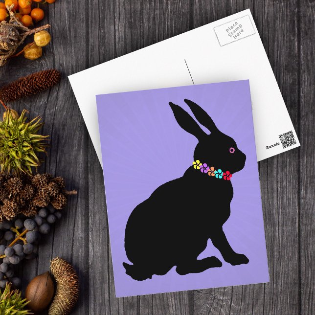 Seated Black Rabbit in Silhouette Pretty Flowers Postcard (Sitting black Easter or Spring Time rabbit wearing Flowers on purple postcard.)